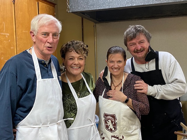Four people in aprons