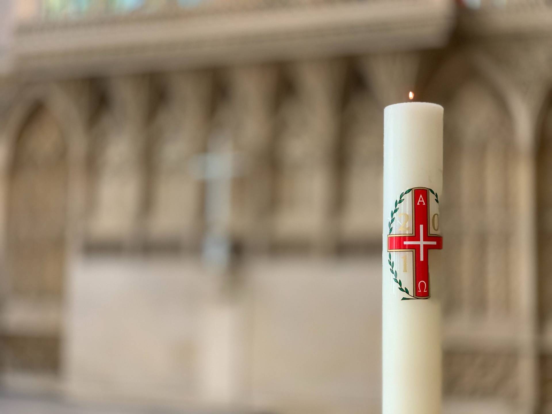 A candle at the front of a church.